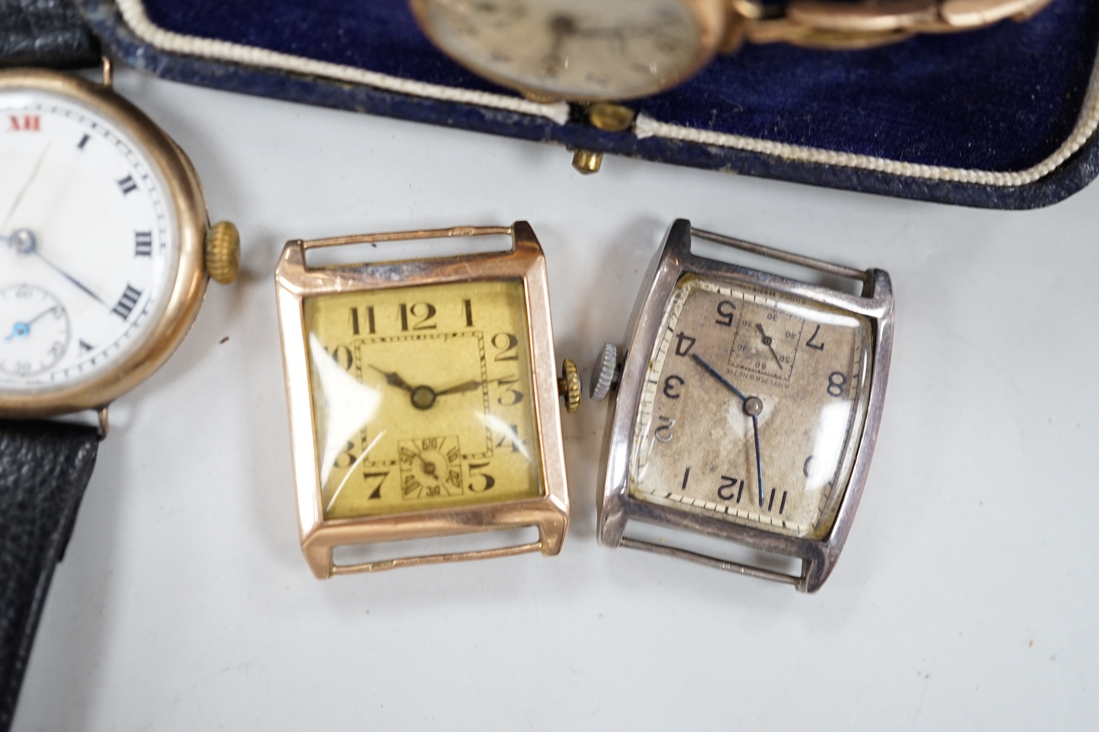 A lady's 1930's 9k J.W. Benson manual wind wrist watch, on a 9ct flexible bracelet, one other gentleman's 9ct gold wrist watch and four other wrist watches.